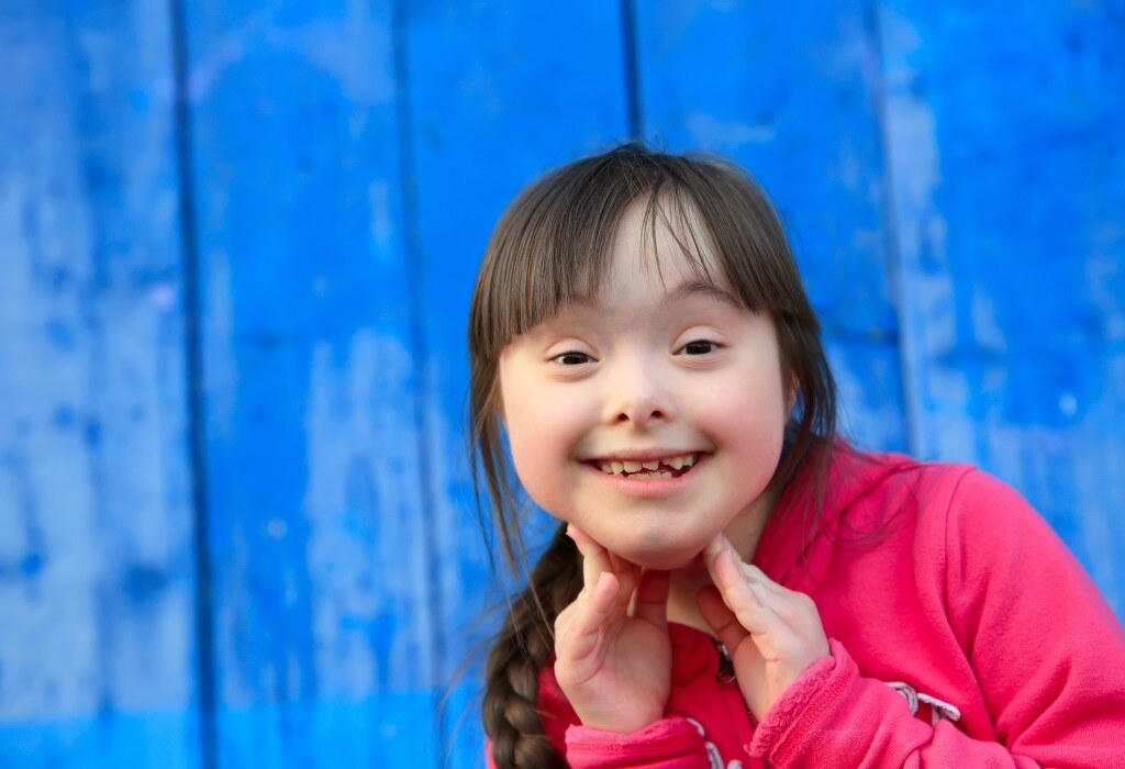 Girl-with-Blue-Fence-Background